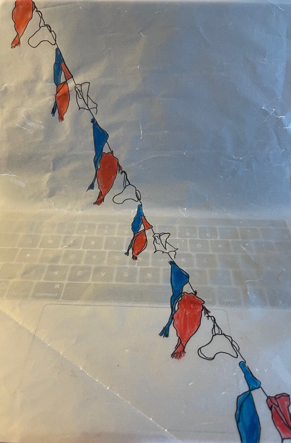 Drawing of tatty red, white and blue bunting flags on tracing paper overlaying a laptop