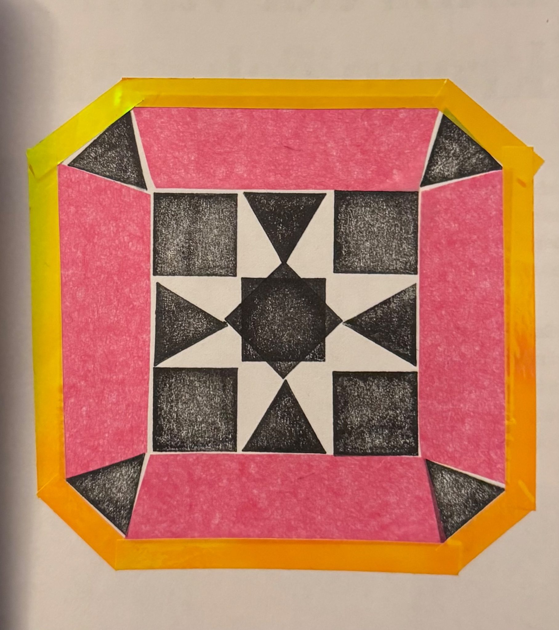 Black and white pattern with pink tissue paper and yellow tape forming a square around the pattern.