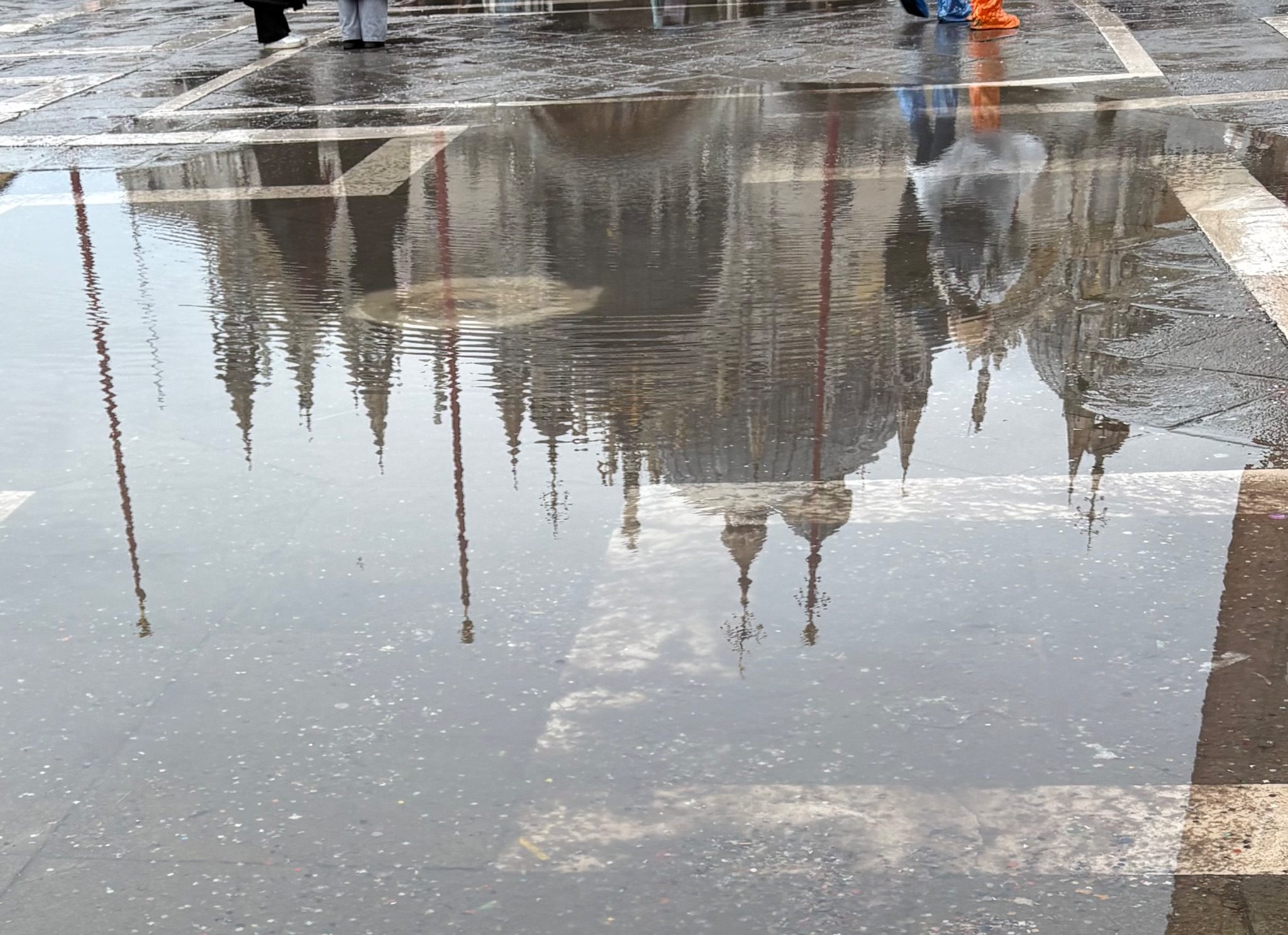 Reflection of St Mark's in a puddle in Venice an hour before it dried up.