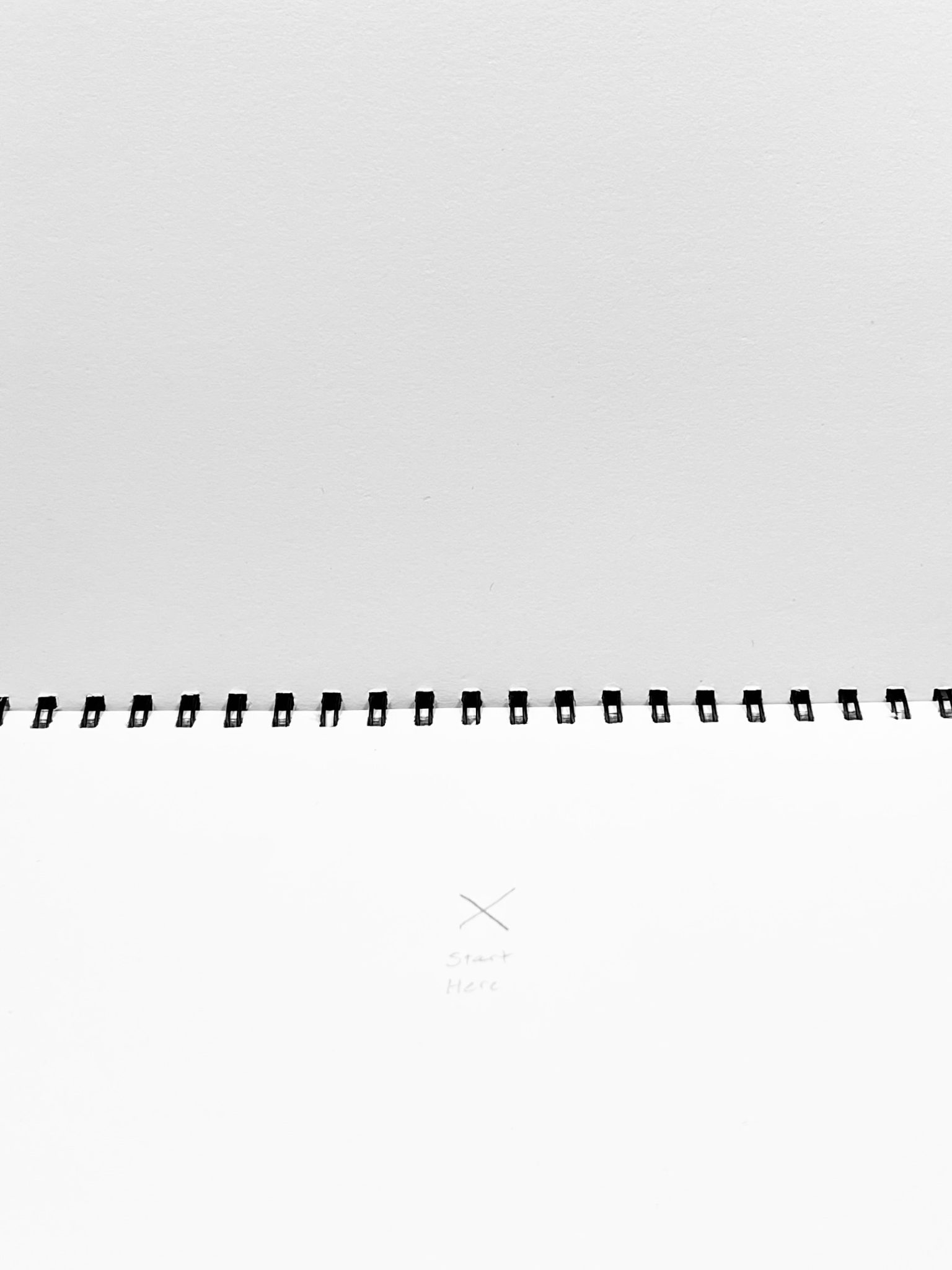 Open sketchbook with an X and the words START HERE