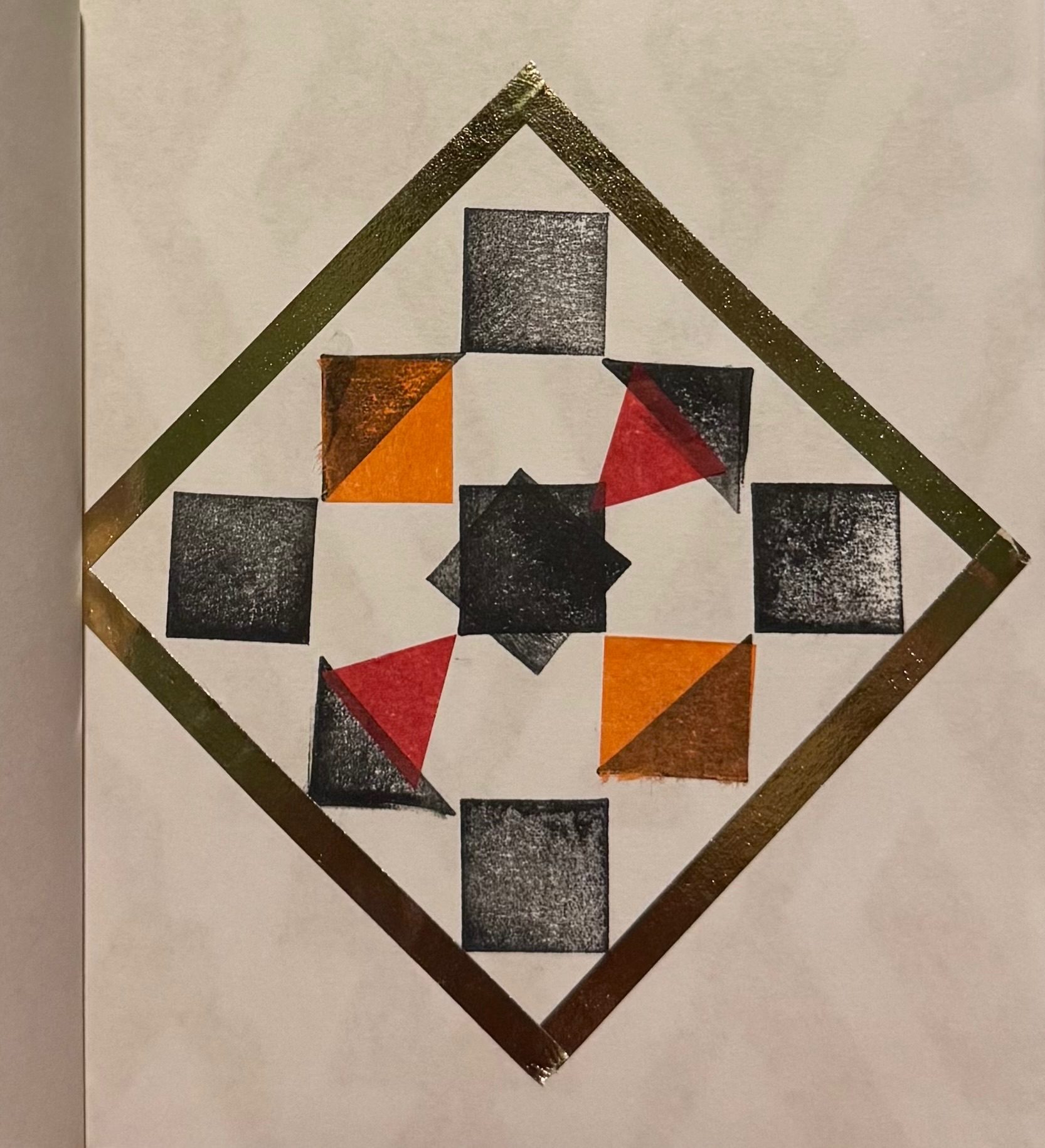 Black and white shapes forming a pattern with a tape outline in a square.