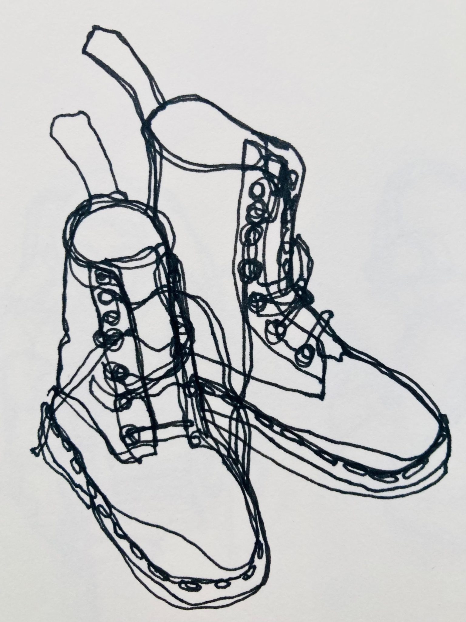 Continuous line drawing of a pair of Dr Marten boots