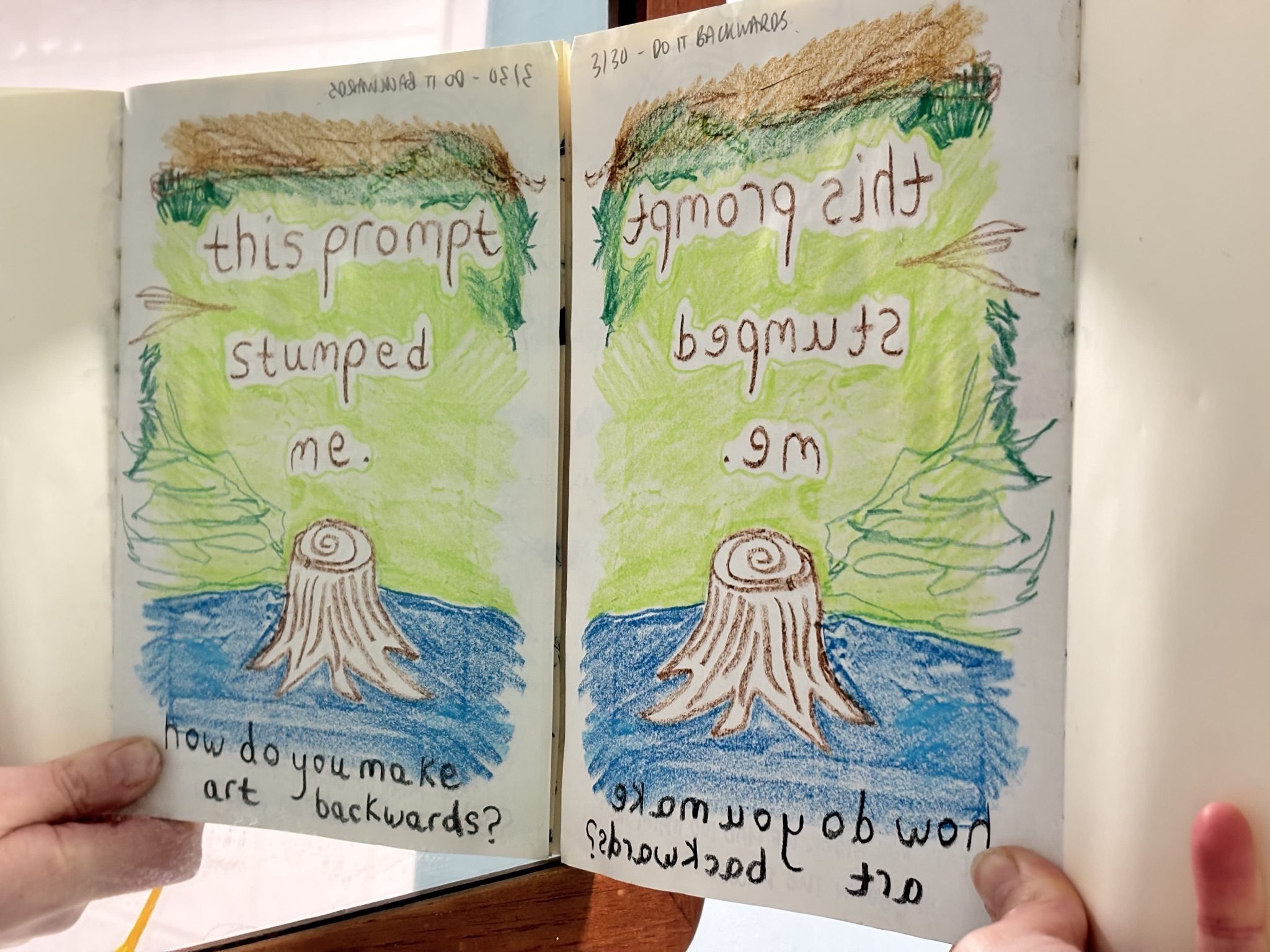 mirrored image with backwards written text “this prompt stumped me. how can you make art backwards?” with an inverted doodle of a tree stump and inverted colours for the sky/grass