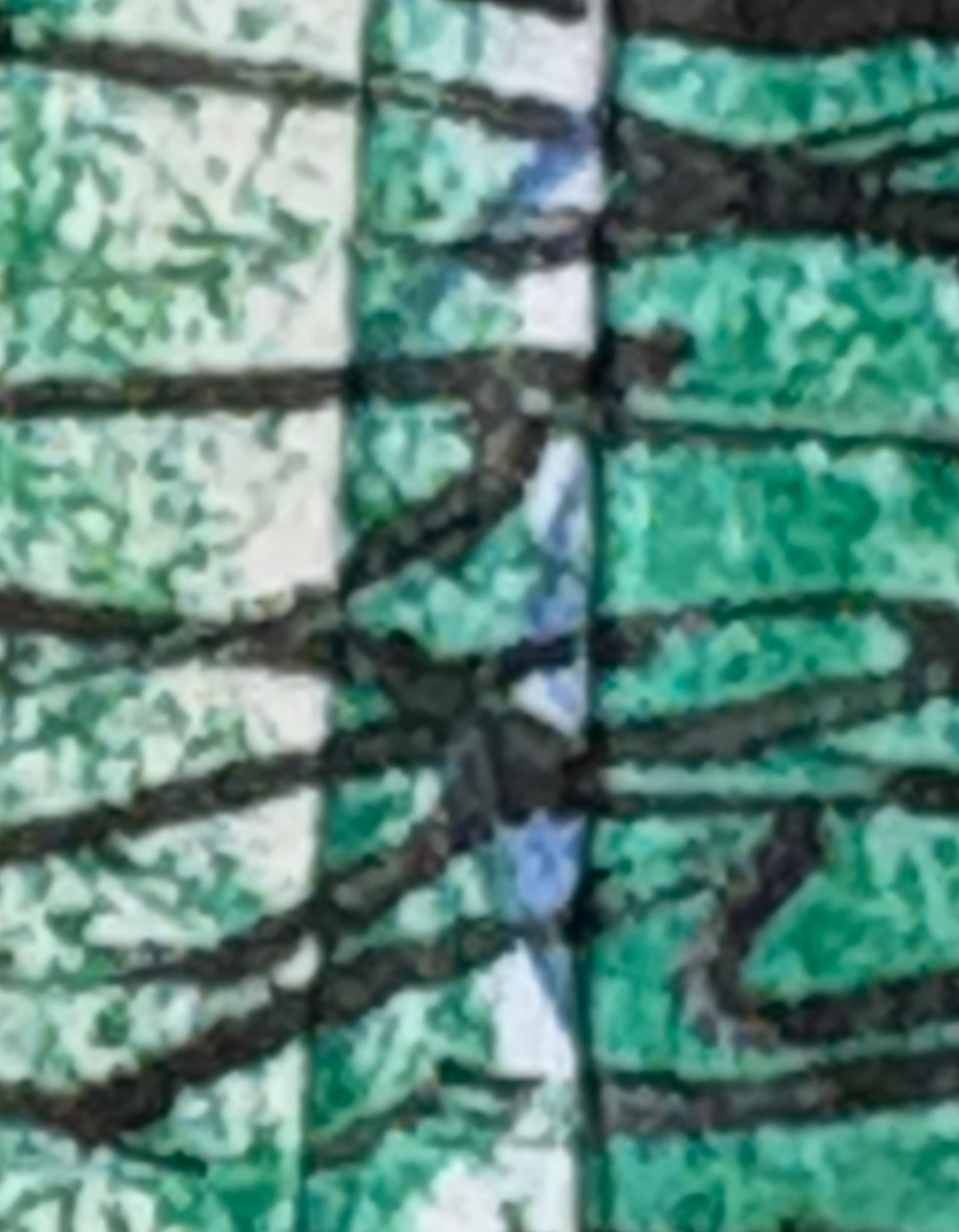 Close up of green and black mark making