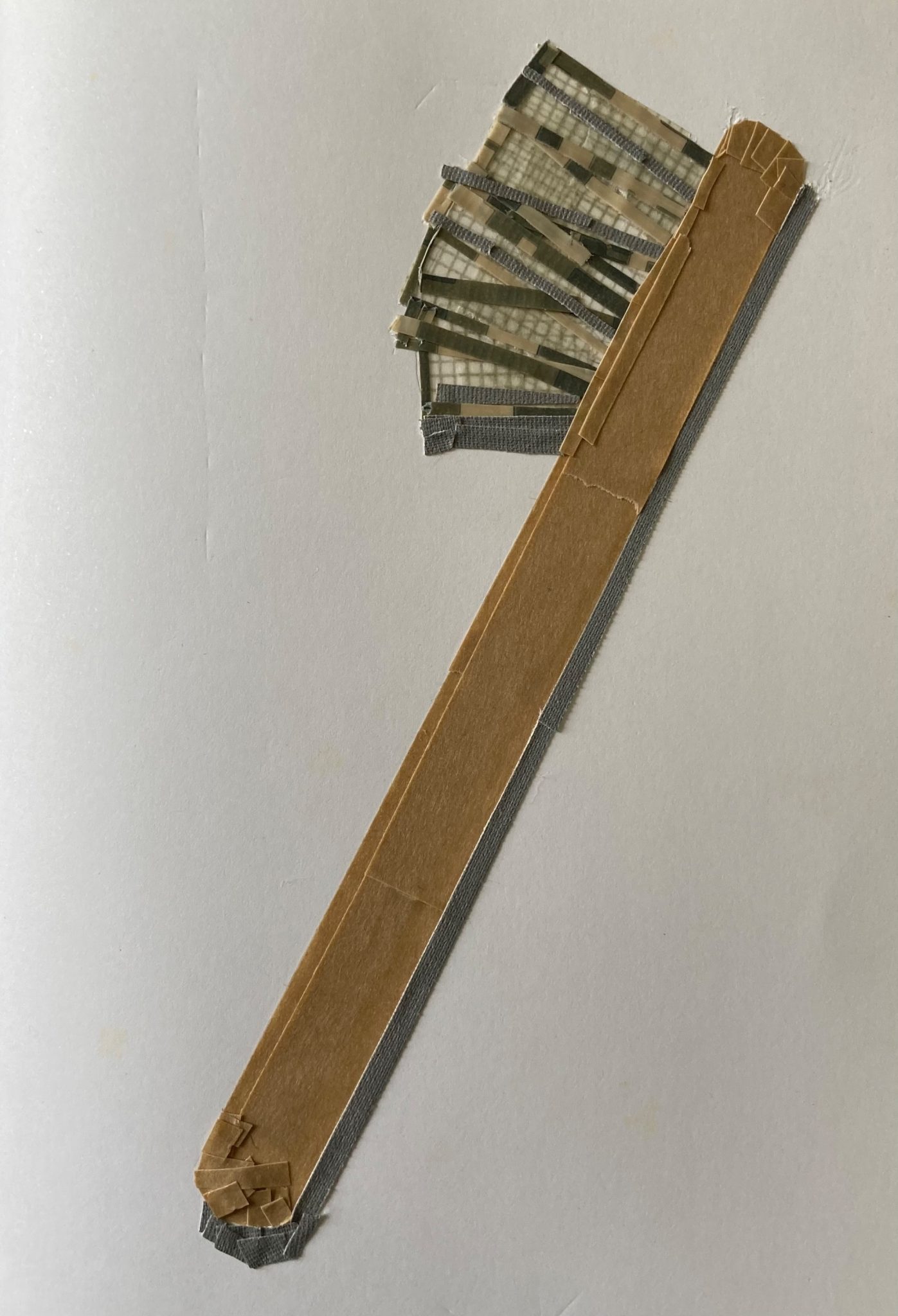 Small brush from coloured tape on paper