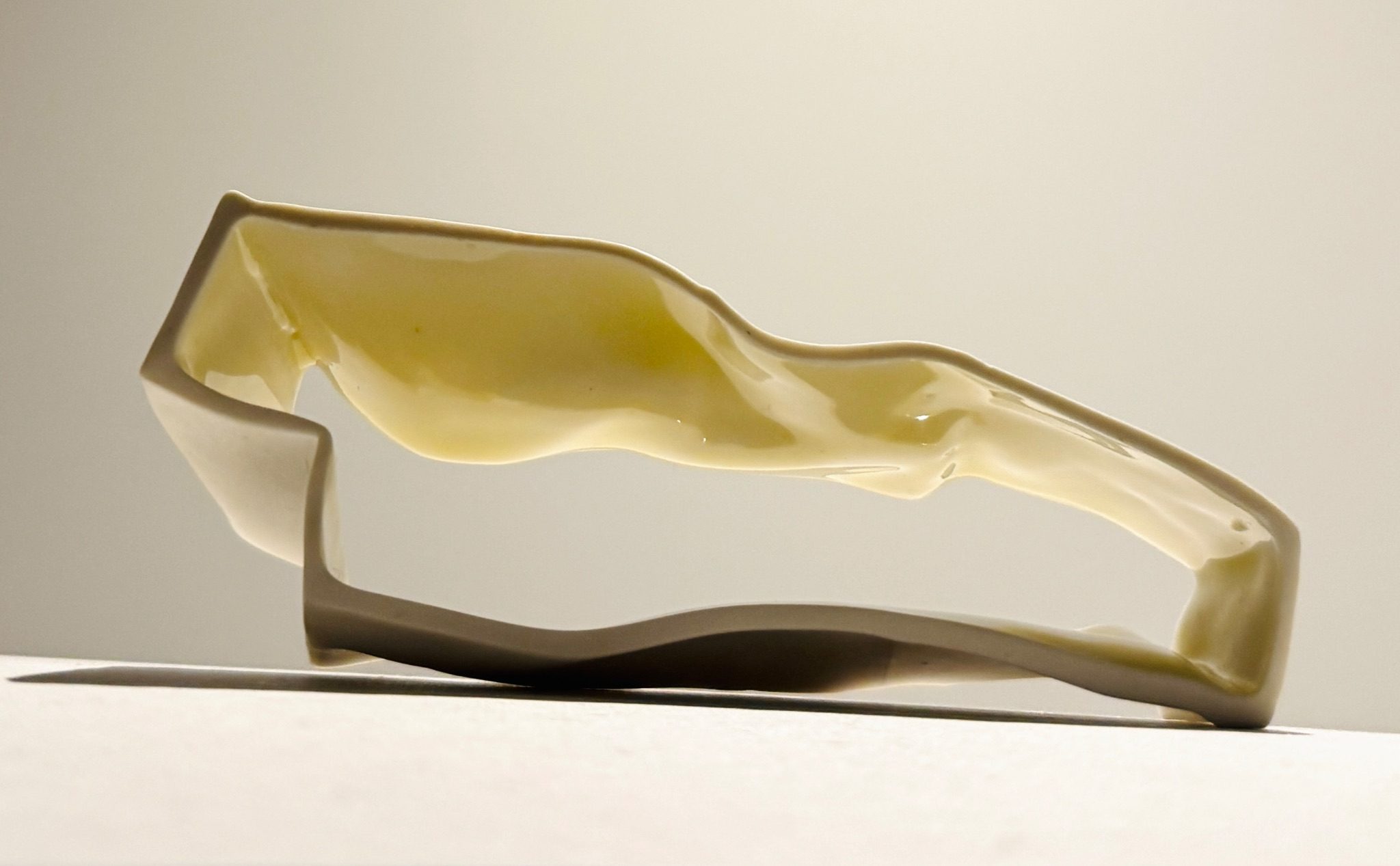 Porcelain Cross section of a texilated sculpture- with undulating shinny glaze