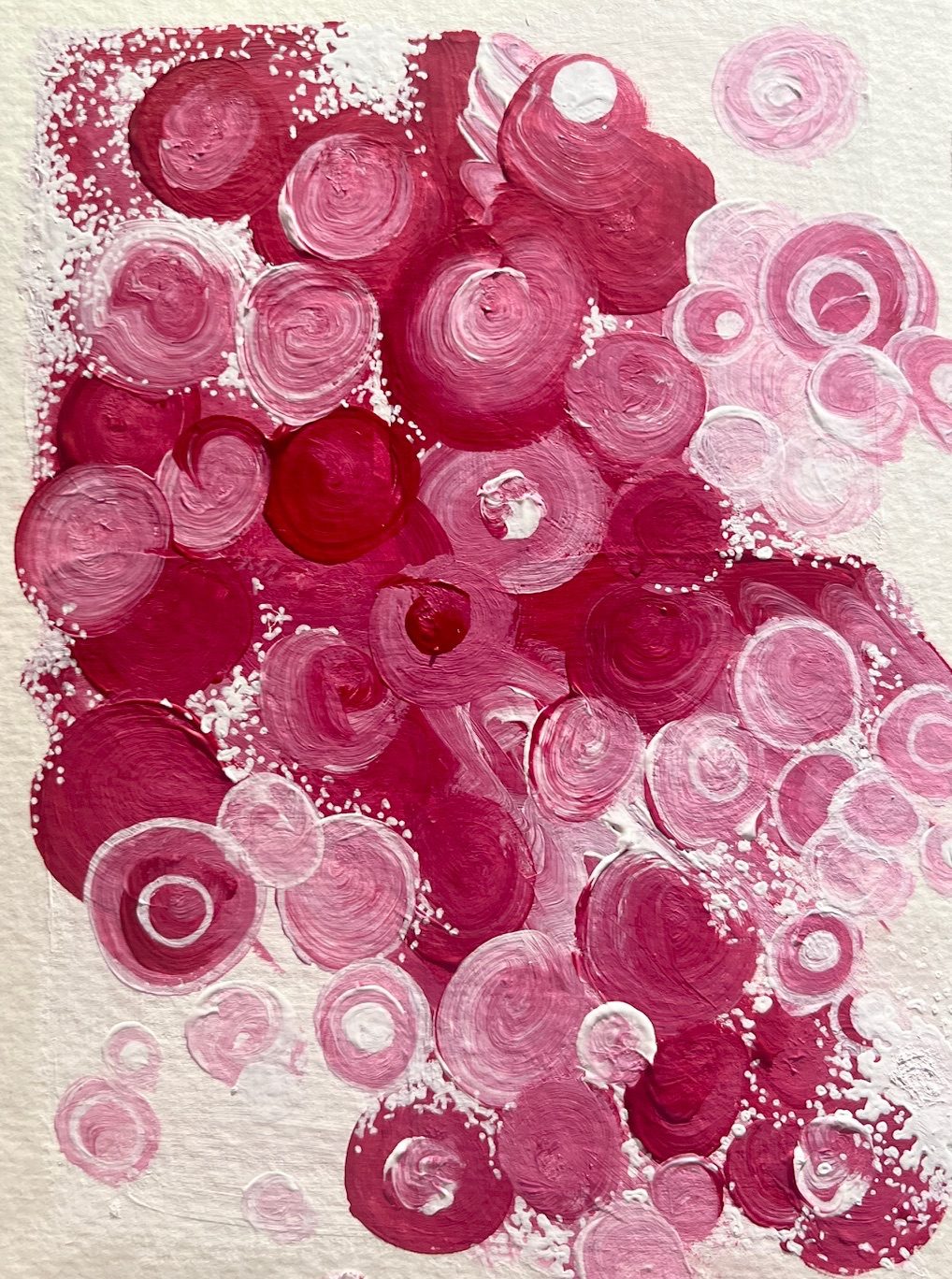 Red and white and blended circular shapes with lots of grouped and separated white dots made with fine tips and acrylic paint.