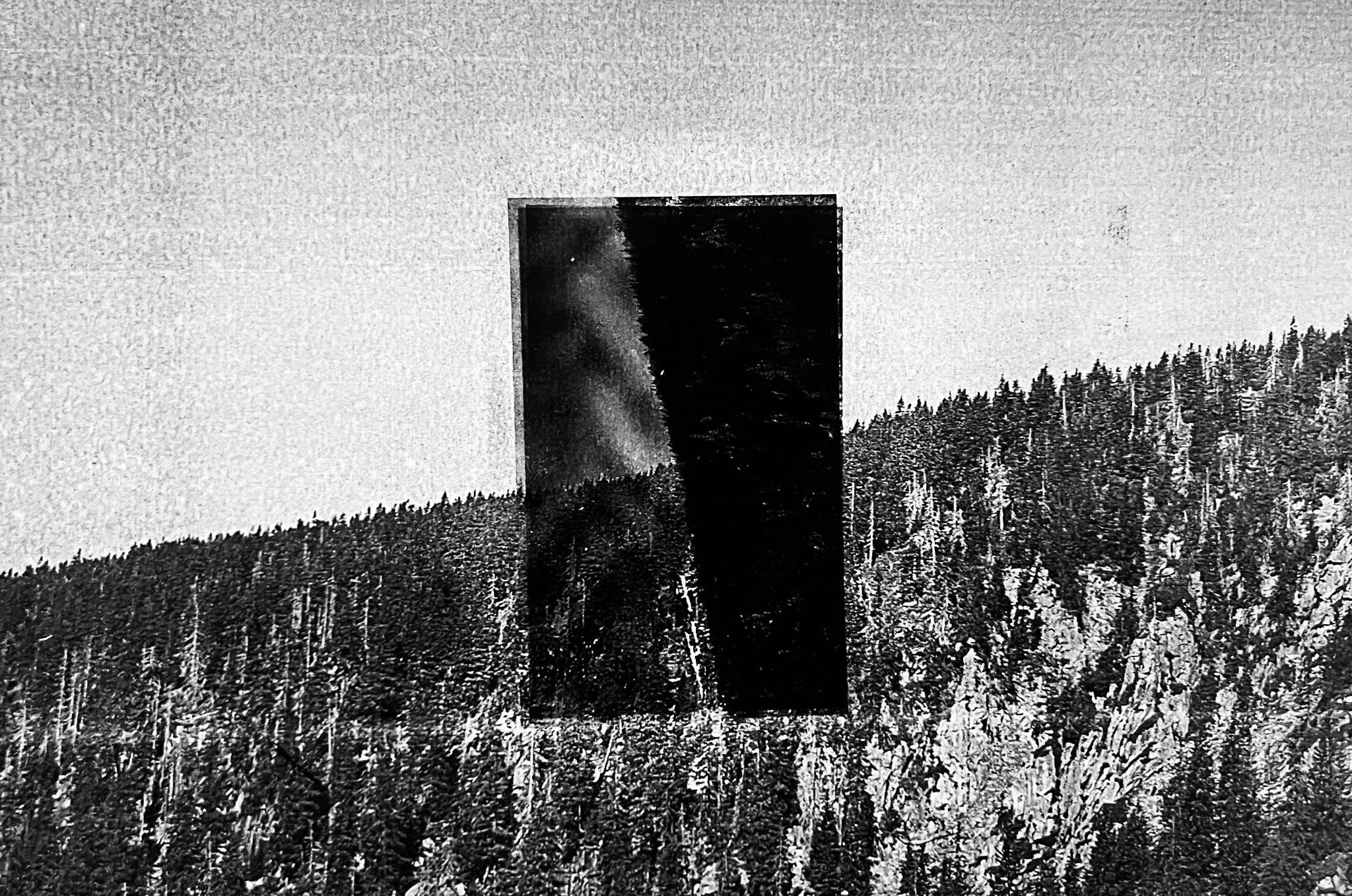 Black and white double print of landscapes.