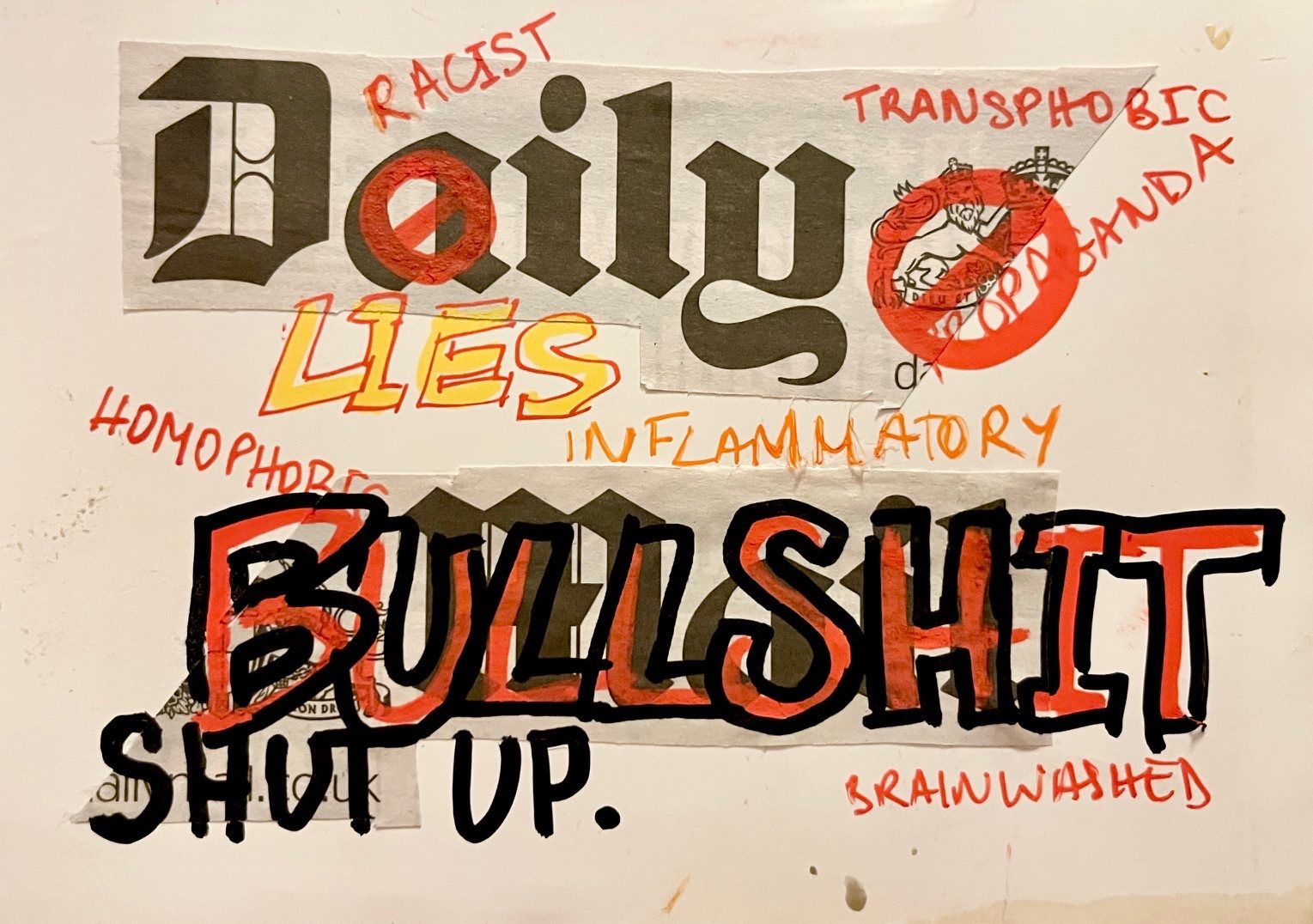 Collage cut out of the daily mail logo covered in graffiti style words such as “propaganda” “transphobic” “racist” “homophobic