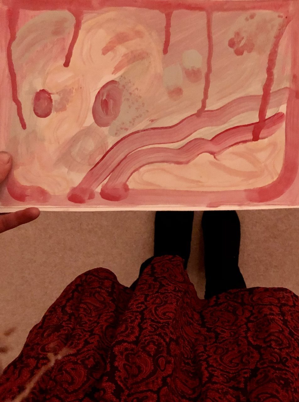 Red dress outfit holding painting with pink dribbles