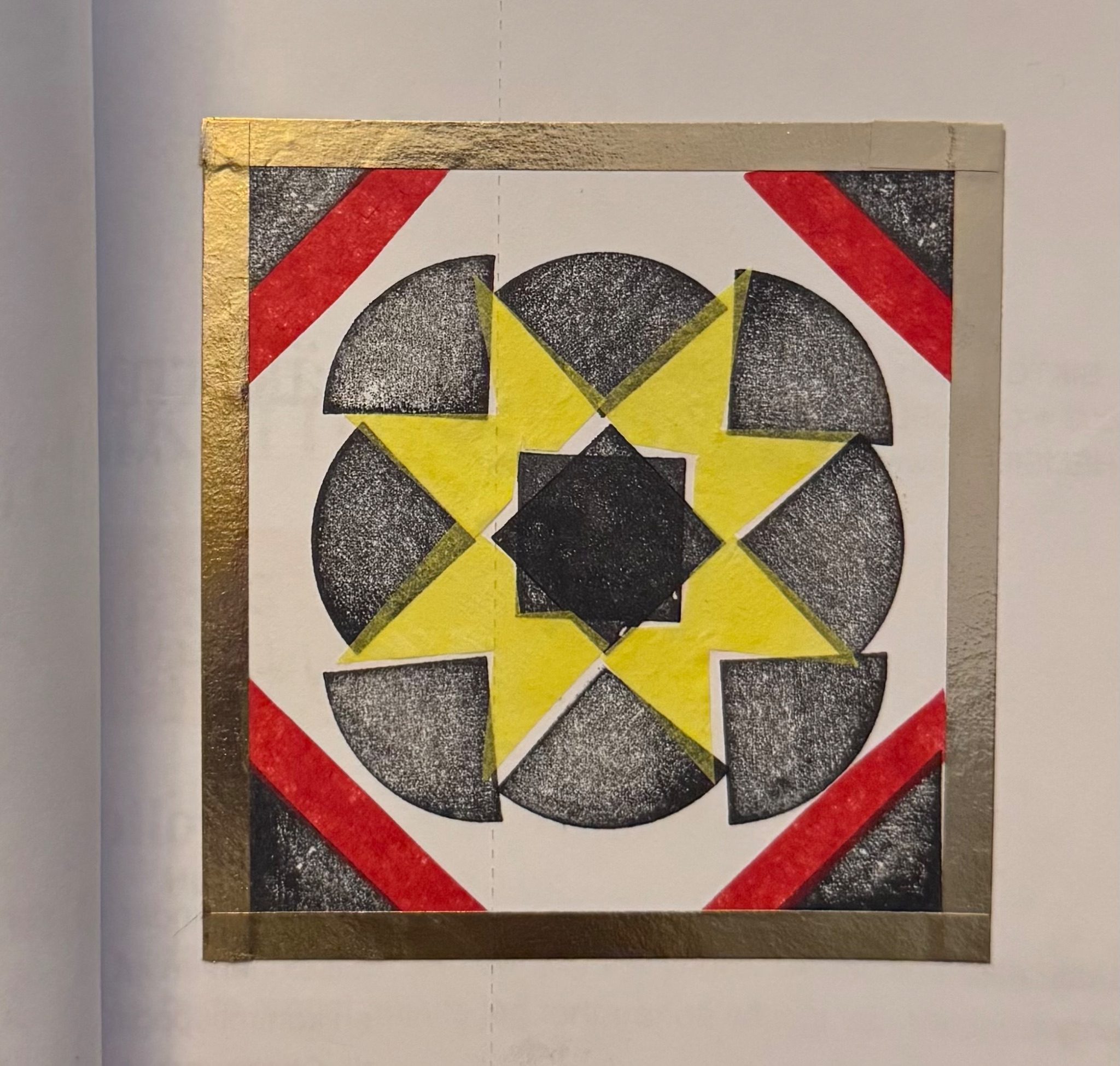 Black and white pattern with coloured tissue paper and a tape frame.