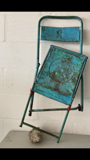 Blue Metal Chair in 2 parts with boulder as prop