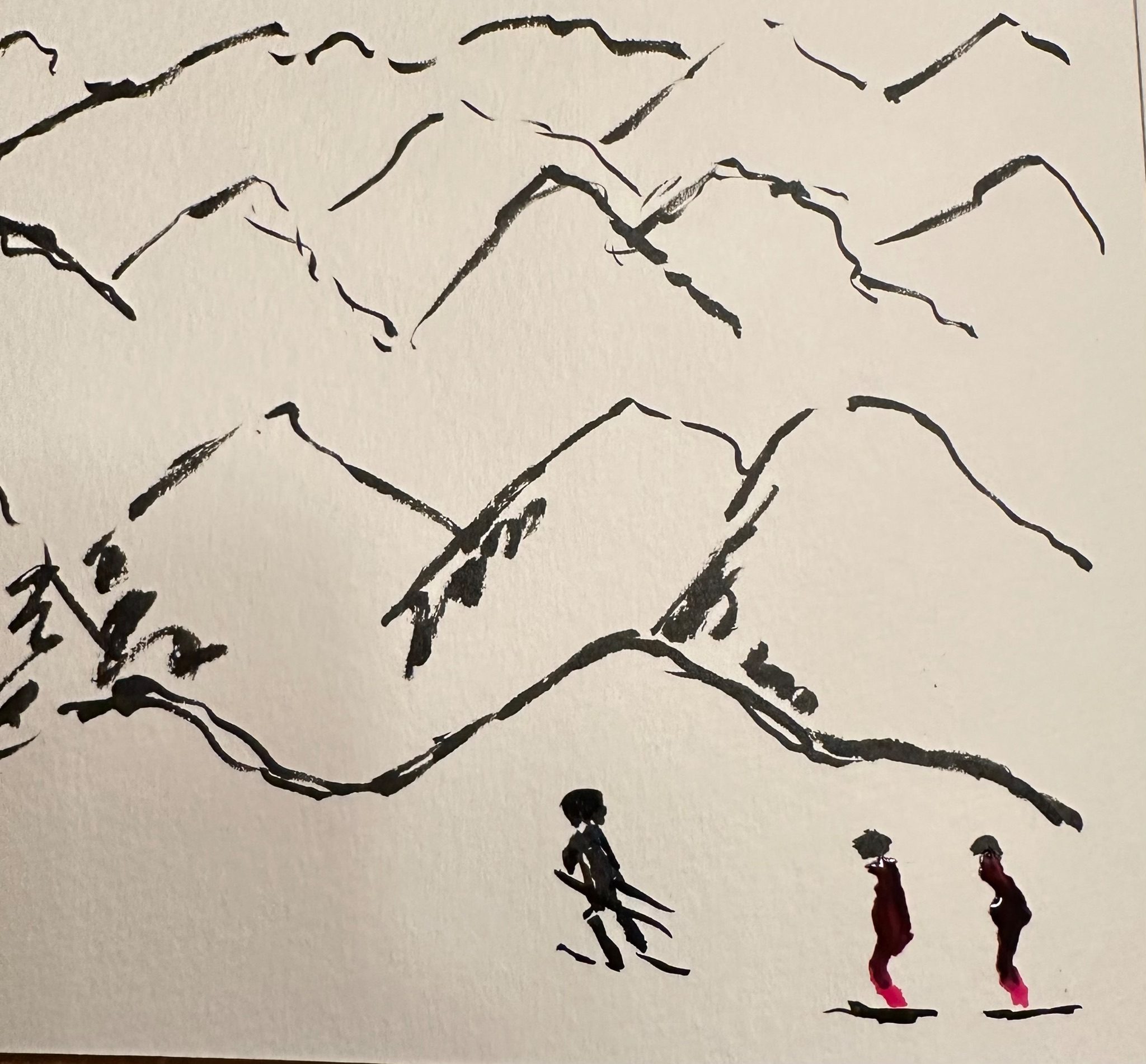 A snow scene with summits in the distance and 3 silhouettes of skiers in the foreground