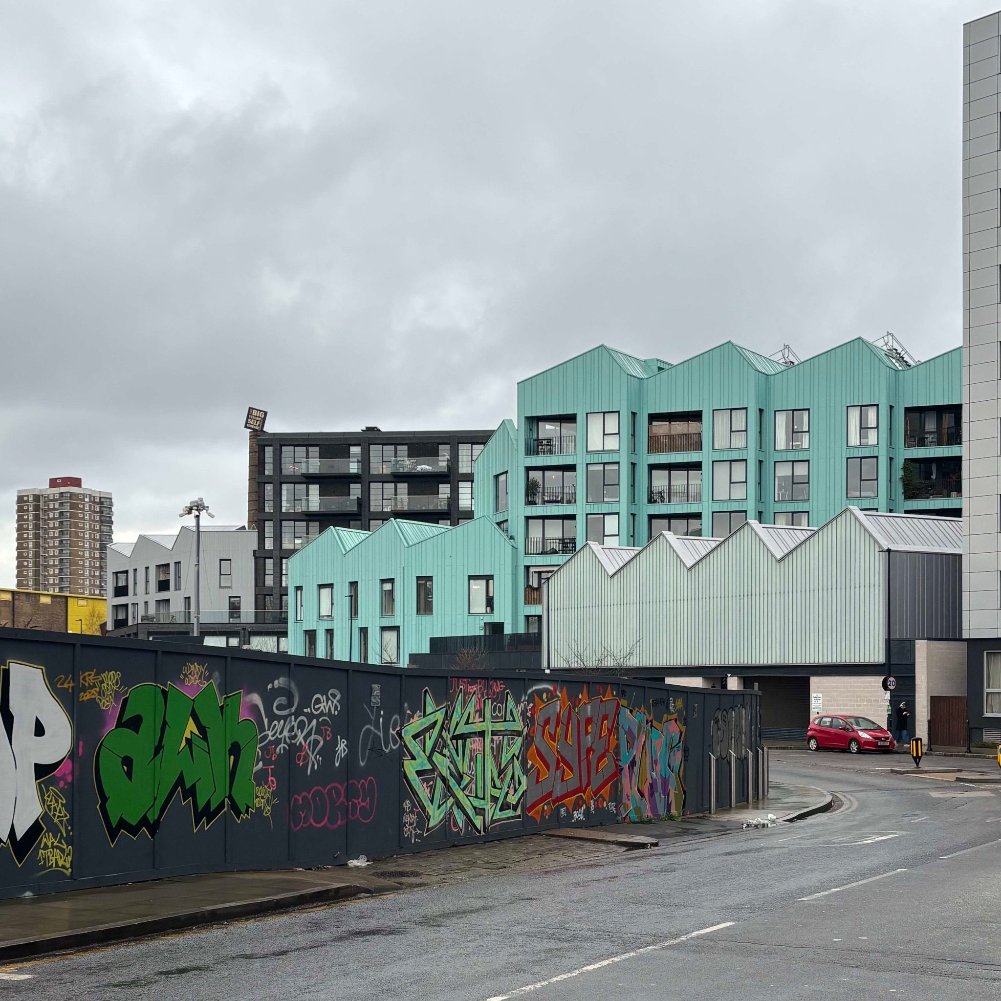 Photograph of new urban development designed with an old factory style roof
