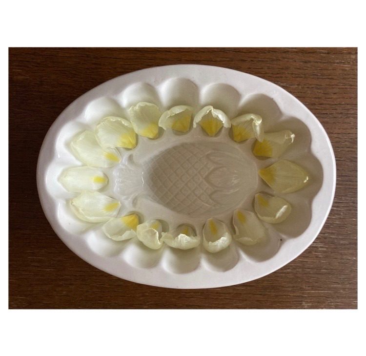 Found objects, jelly mould and tulip petals on a kitchen table.
