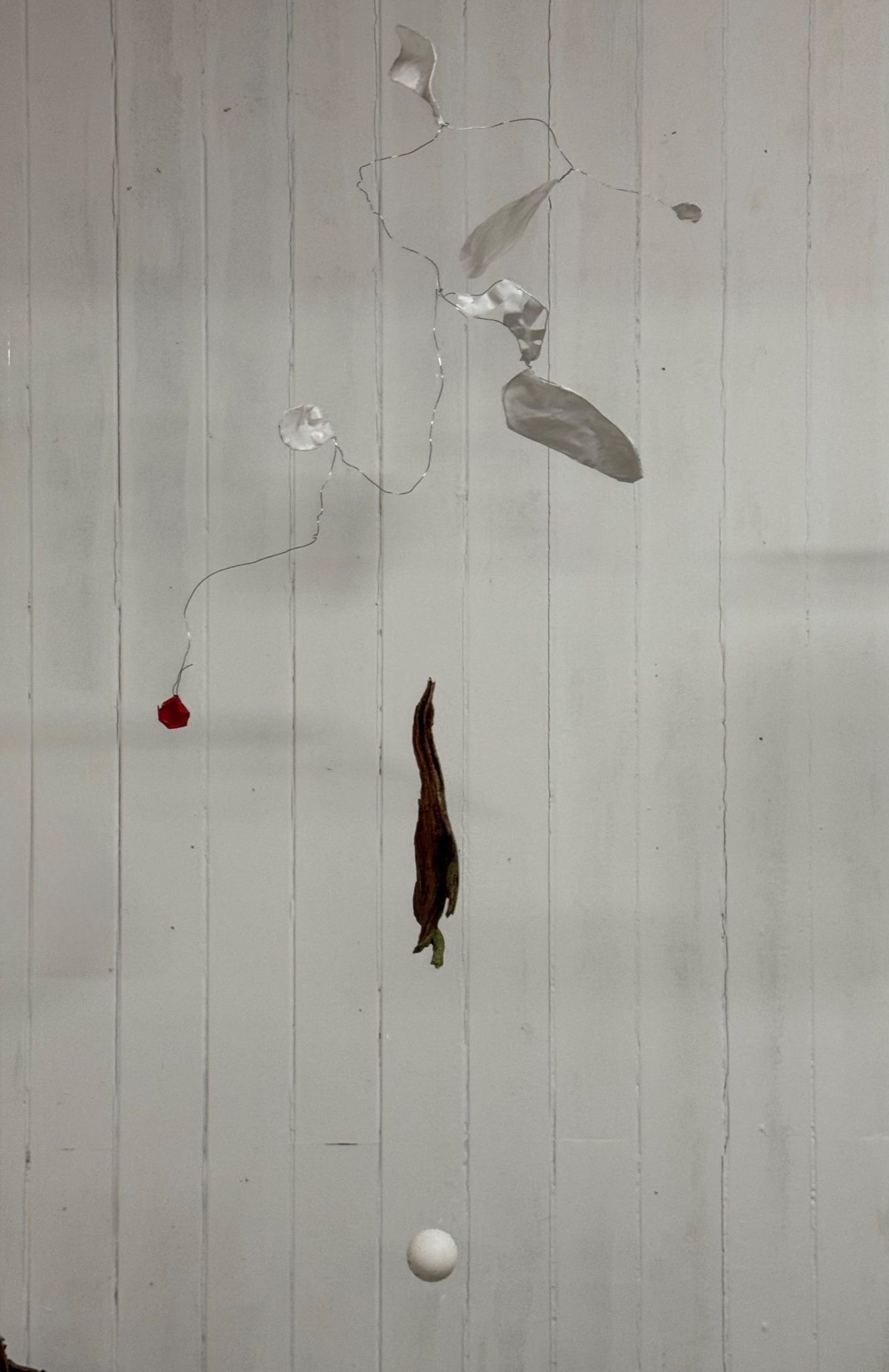 Wire, paper and painted wood with a ping-pong ball hanged on a fish string, moving