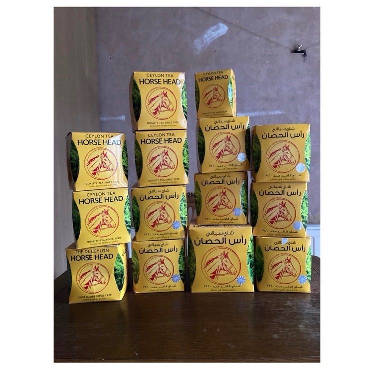 A collection of 14 empty Horse Head tea boxes.