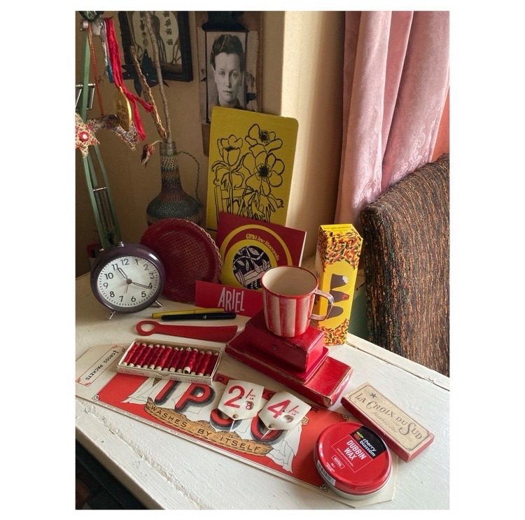 A collection of red and yellow objects on a desk.