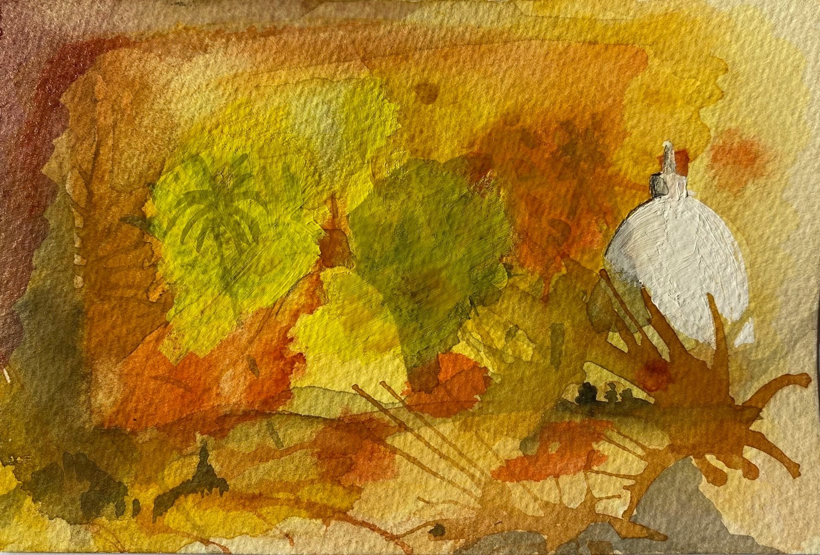 This postcard-sized artwork is painted on textured watercolour paper and filled edge-to-edge with layered washes of warm colour. The dominant tones are ochre, amber, rust, and yellow, with areas of olive green emerging through the layers. The paint appears fluid and uneven, with visible blooms, stains, and overlaps where wet pigments have mixed and settled unpredictably into the paper.  Across the surface are organic, branching marks in brown that resemble splashes, roots, or hand-shaped shadows reaching outward. Near the right edge of the image is a rounded white form, painted thickly and opaquely, standing out against the surrounding warm colours. A small darker mark sits on top of this white shape, suggesting a lid, flame, or point of contact.  The composition feels loose and intuitive rather than controlled. There are no hard outlines; instead, shapes dissolve into one another through layered transparency. The surface records movement, soaking, dripping, and revision, making the act of painting visible. The overall impression is of warmth, mess, and emergence — a moment of holding light within disorder.