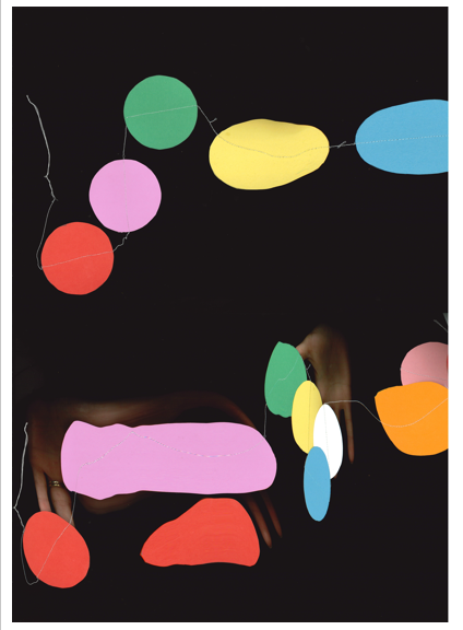 An image of paper circles being dragged over an open scanner