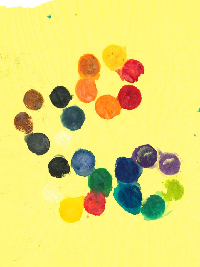Colourful circles of paint on tissue paper