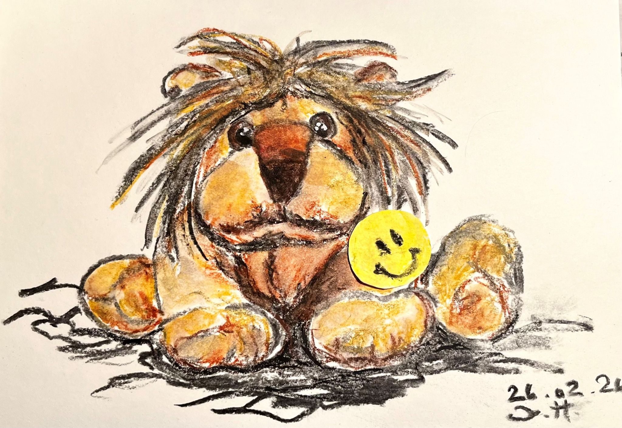 I used charcoal, water-soluble colour wax pastels and water. The picture shows a soft toy, a lion, looking slightly dishevelled and wearing a yellow smiley button.