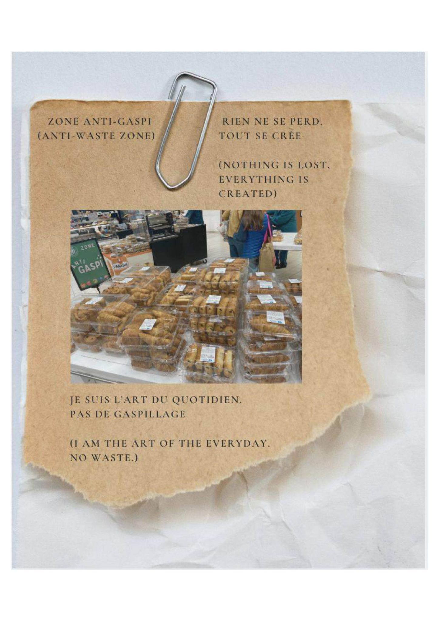A torn scrap of brown paper, clipped to a crumpled white background, displays a photo of stacked pastries in a supermarket's 