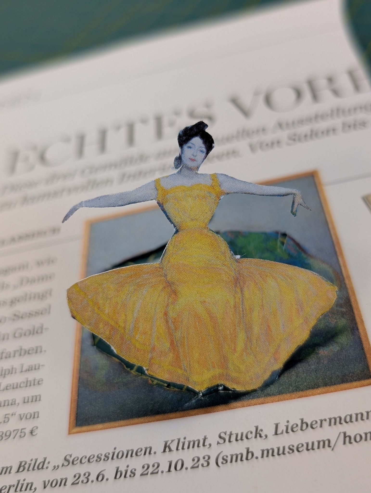 reclining cut out lady appearing to leap out of newspaper