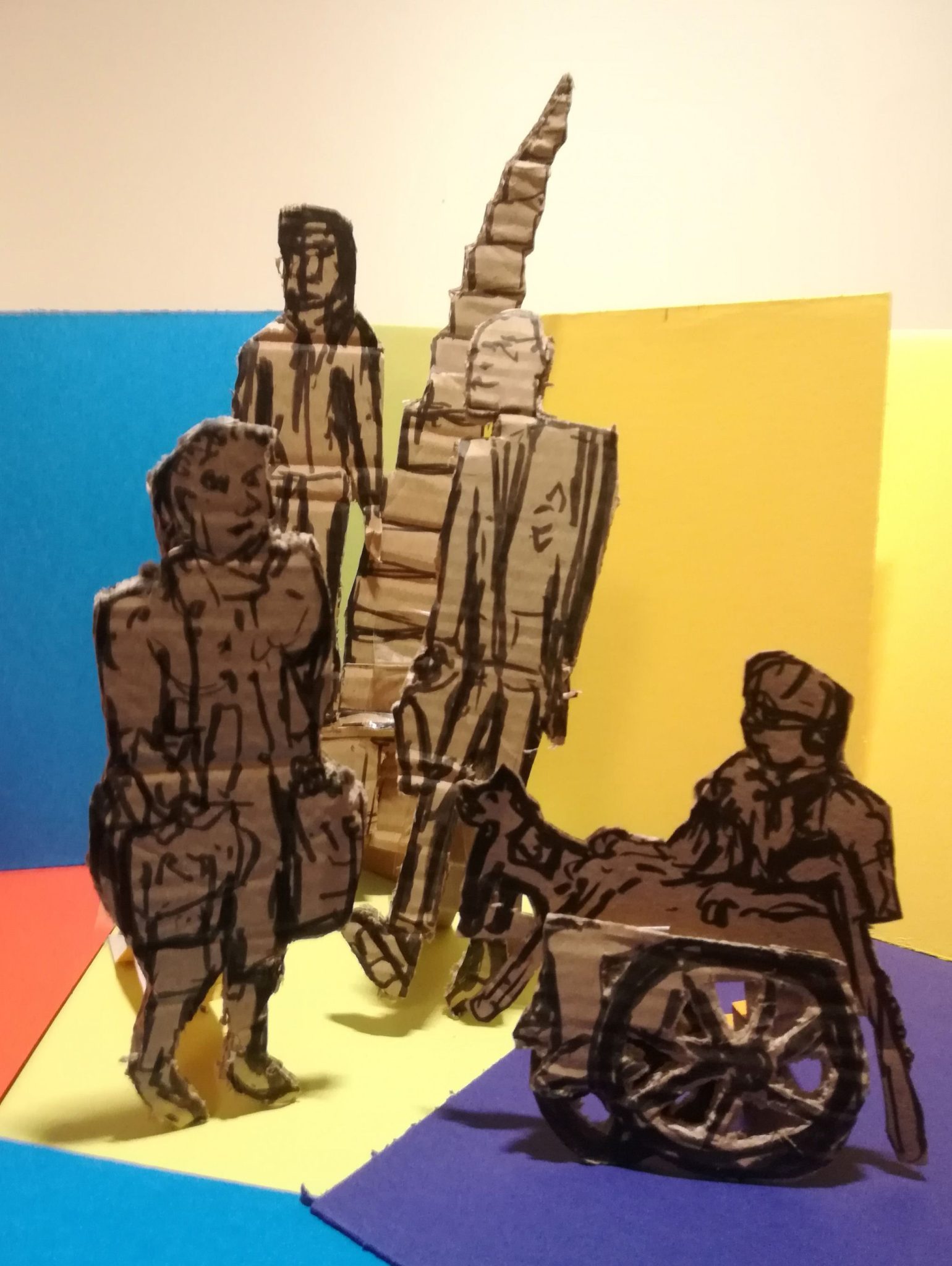 Figures and disappearing staircase sketched in black pen on cardboard, cut out and placed on a variety of brightly coloured cards (and photographed)
