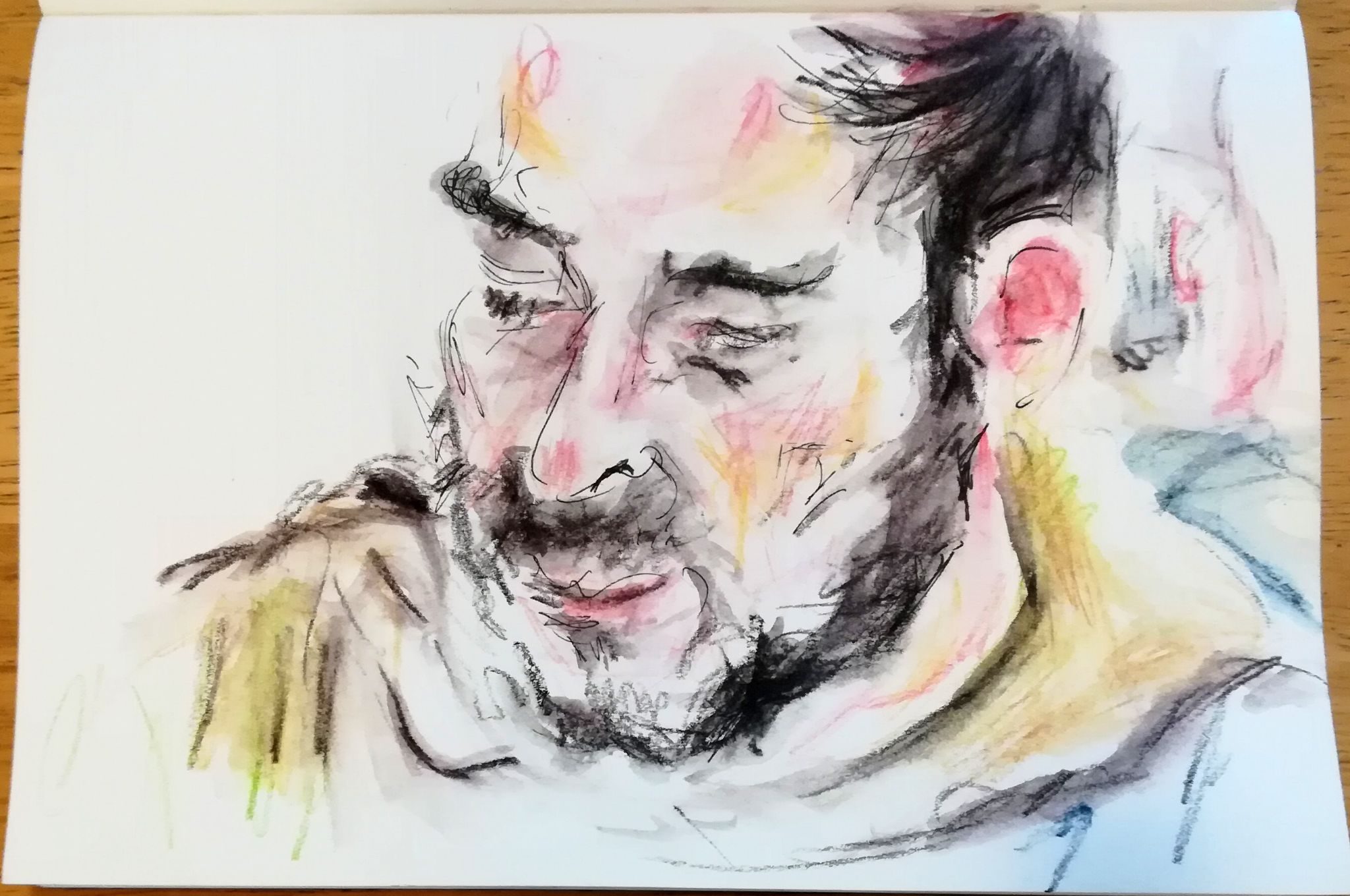 One of my art group decorating the blurb for our upcoming exhibition in the park Hub cafe; medium; black pen and aquarelle pencils