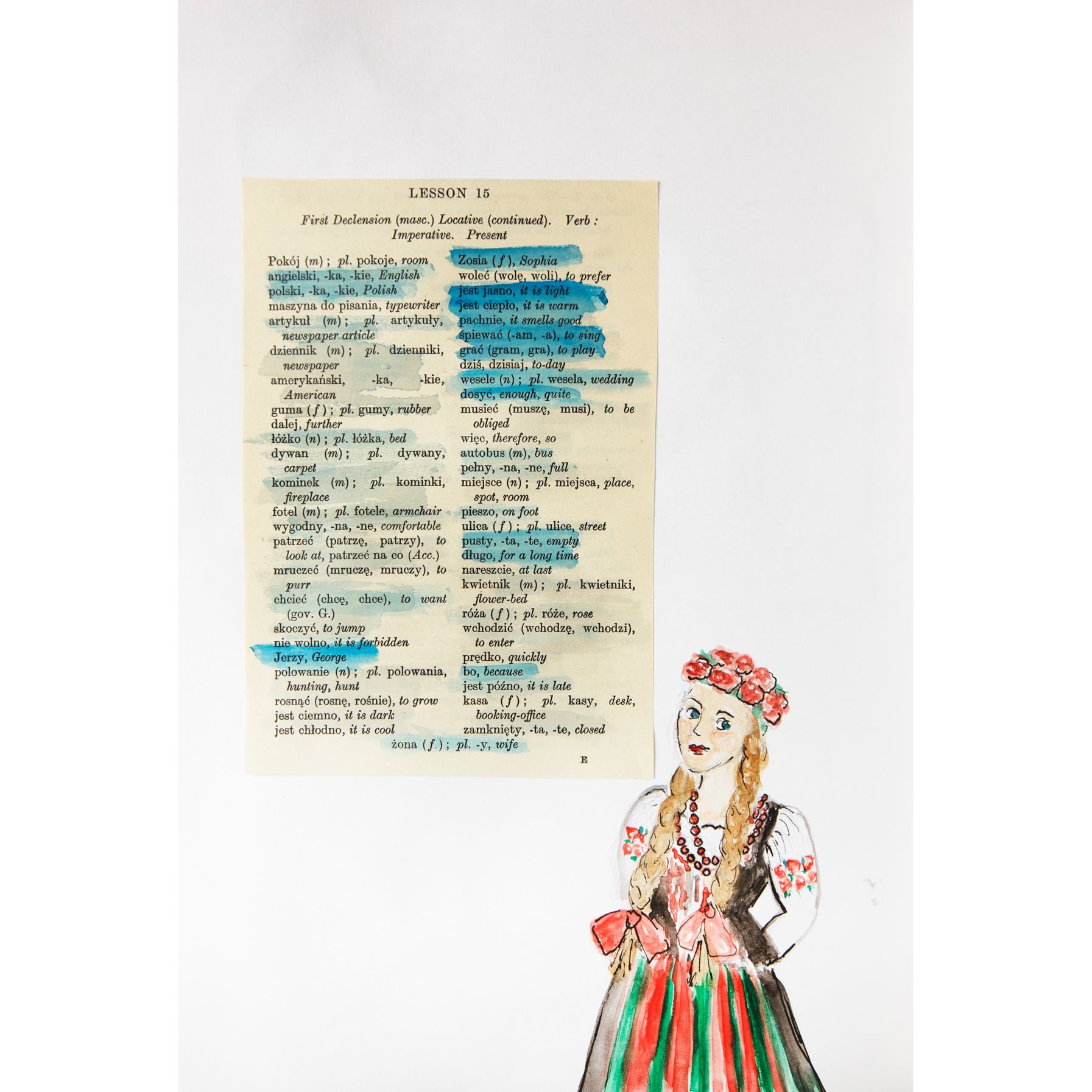 A sheet from a Polish grammer book with a Polish , traditionally dressed woman looks on