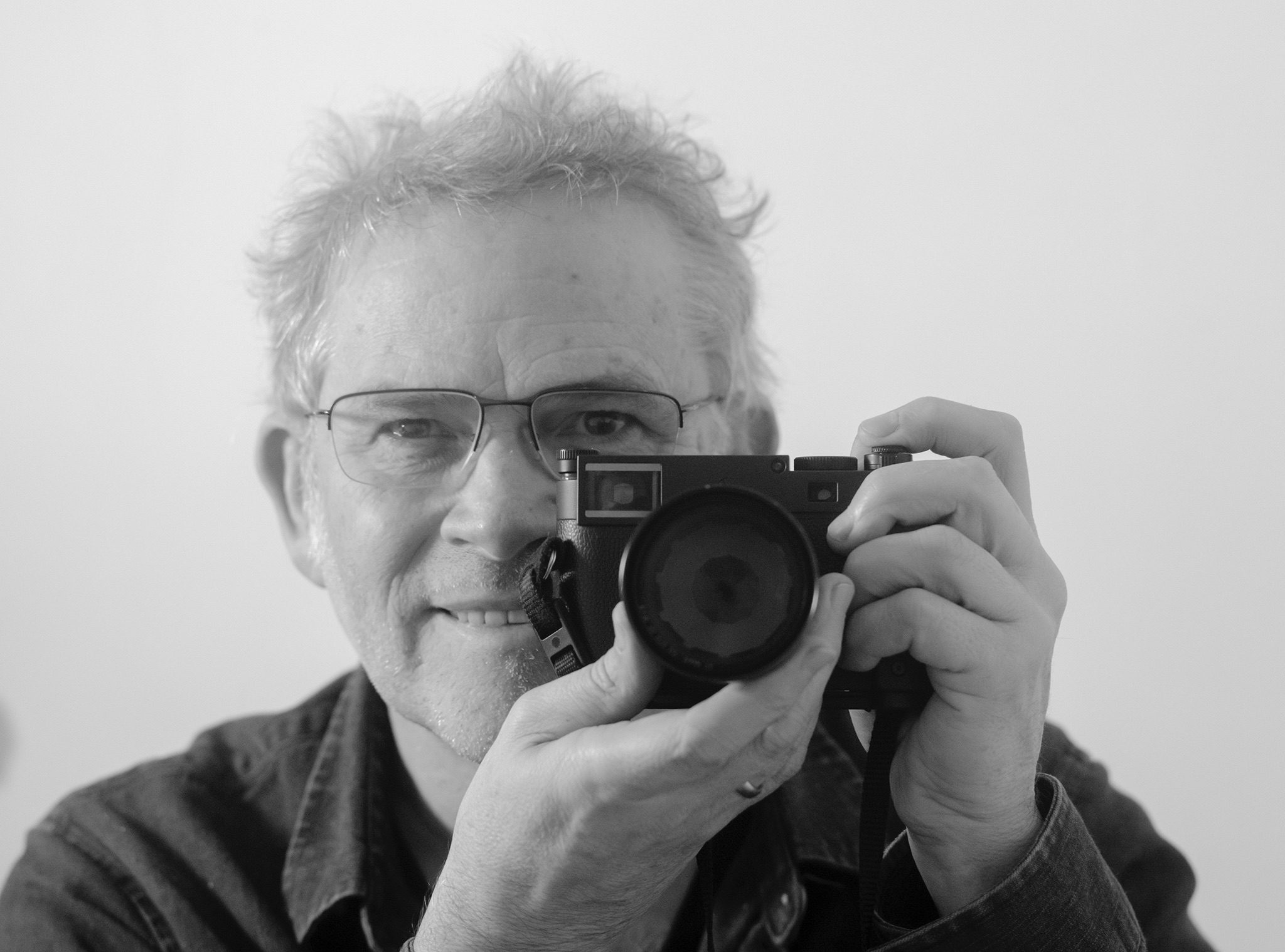 Black and White self portrait made with camera to face in a mirror.