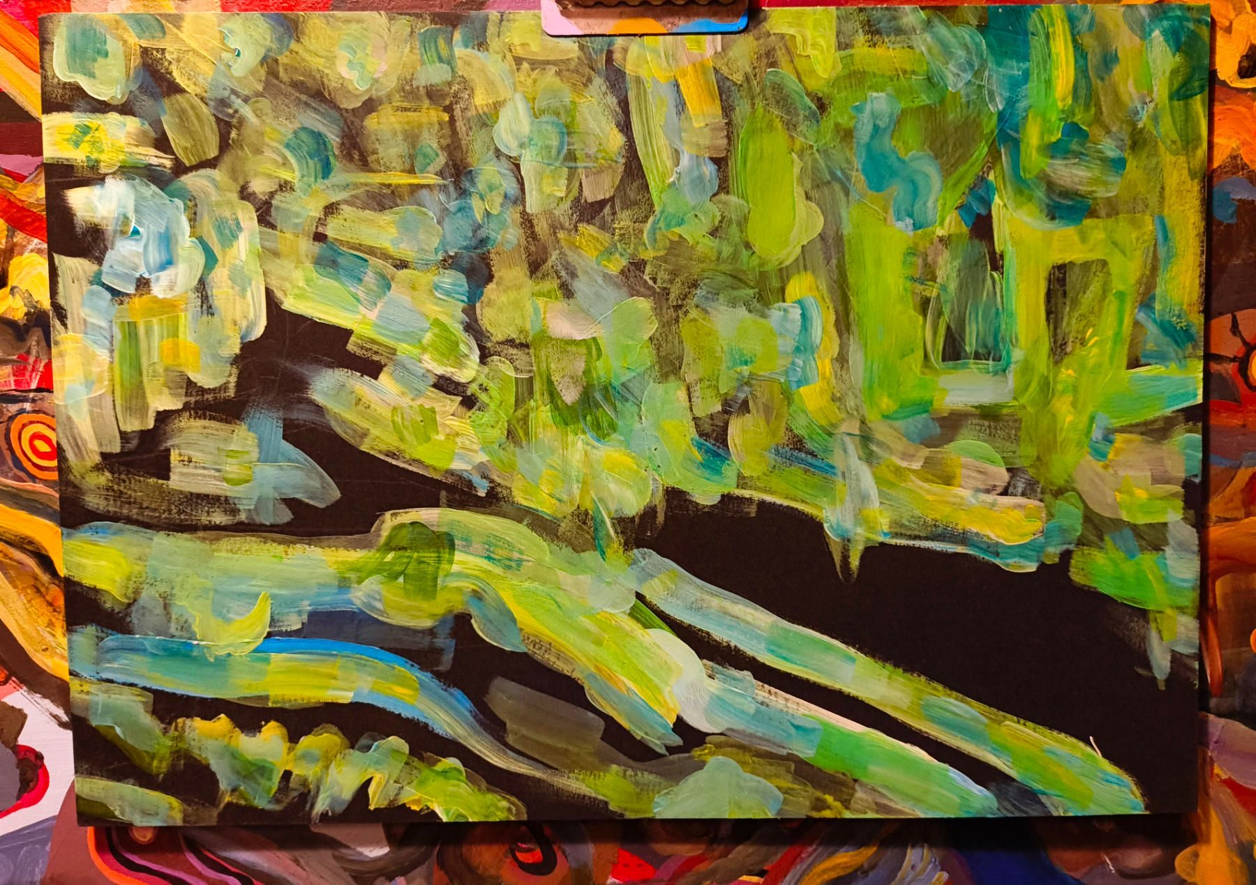 An abstract painting in green and black
