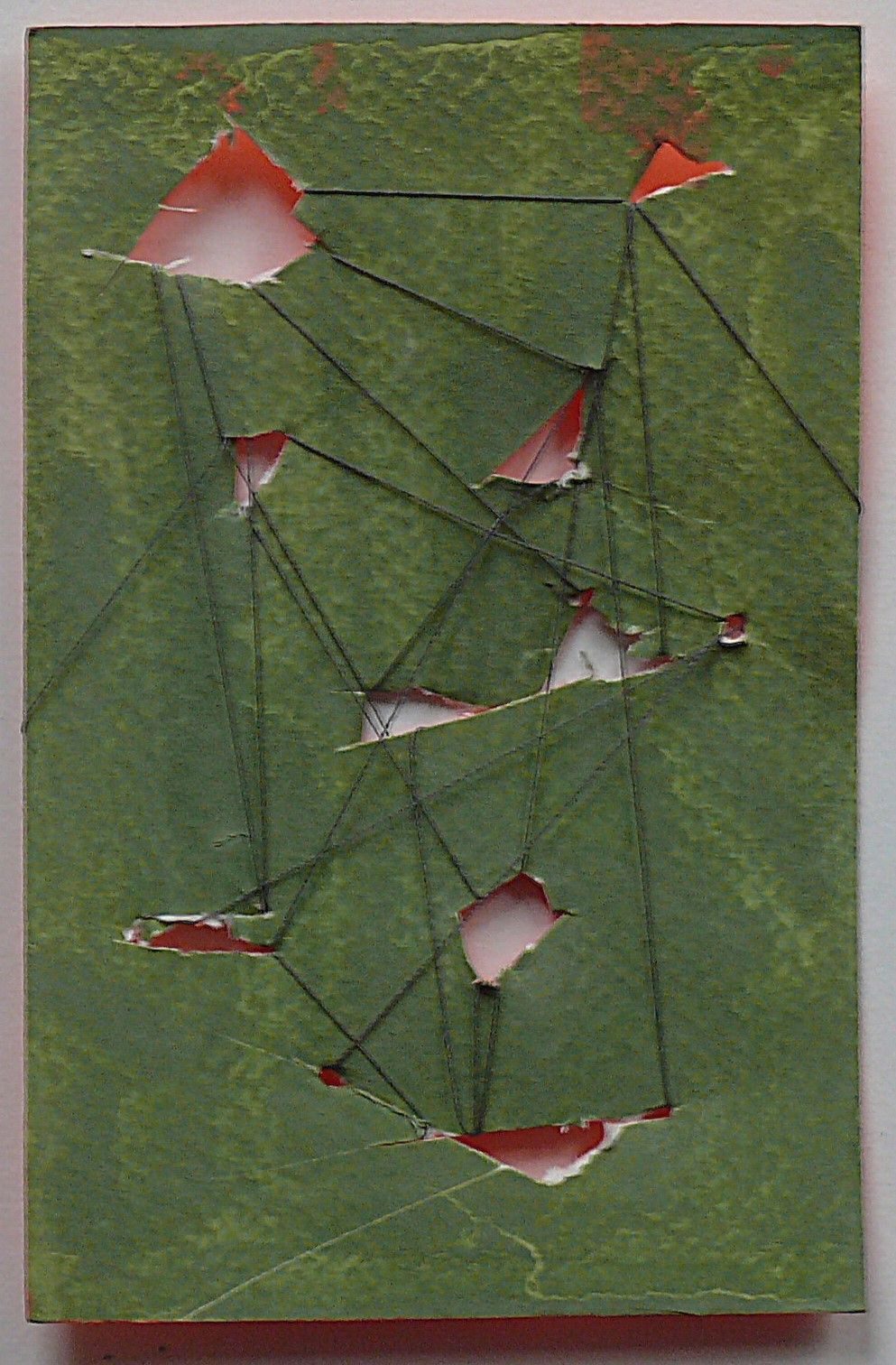 this is a green earth pigment, with   orange underneath and some threads