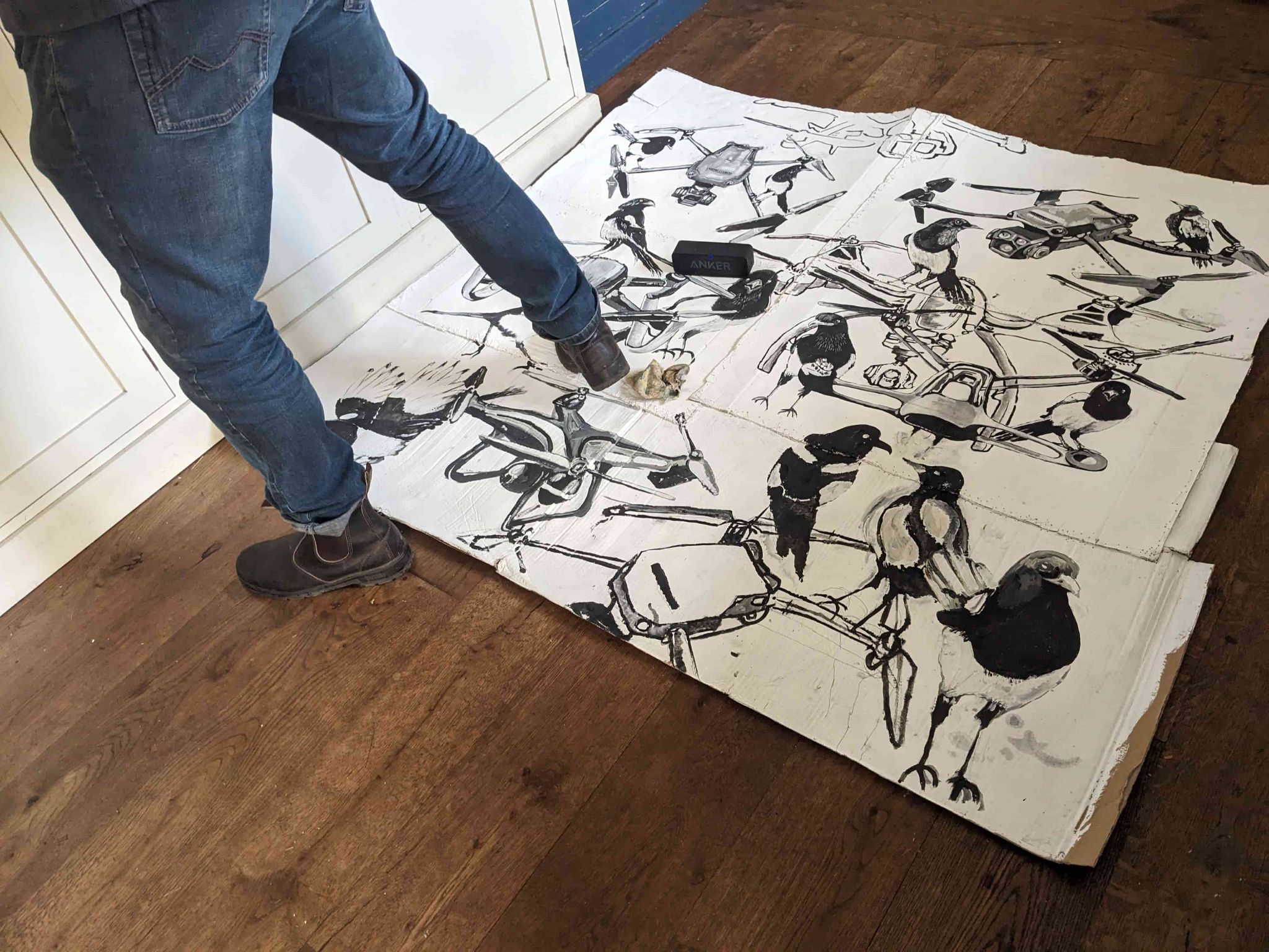 Someone walking on a painting on the floor