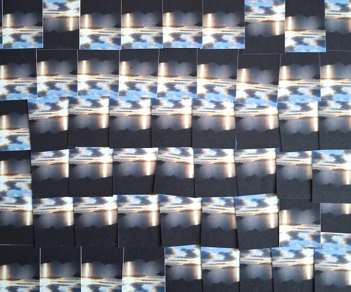 Multiple repeat images - old business cards cut out and reassembled to form a new landscape....