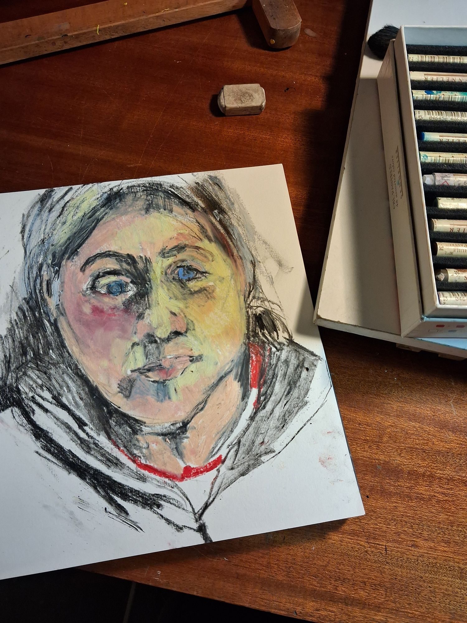 Self portrait in oil pastel and charcoal on paper