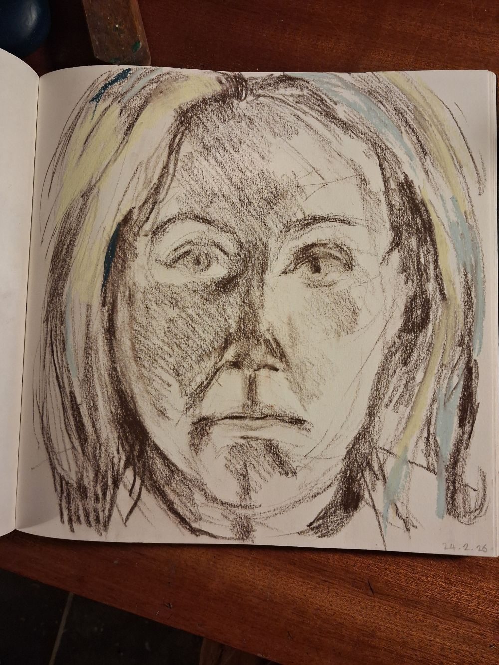 Self portrait in brown pencil on paper