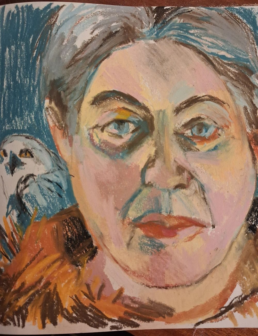 Self portrait in chalk pastel on paper, with owl