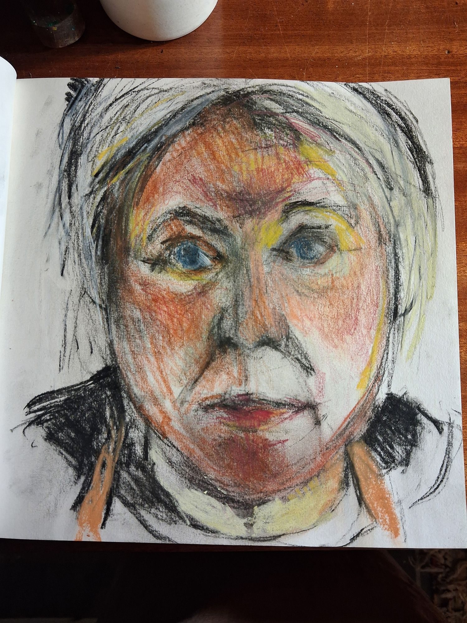Self portrait in black chalk and colour pencil on paper