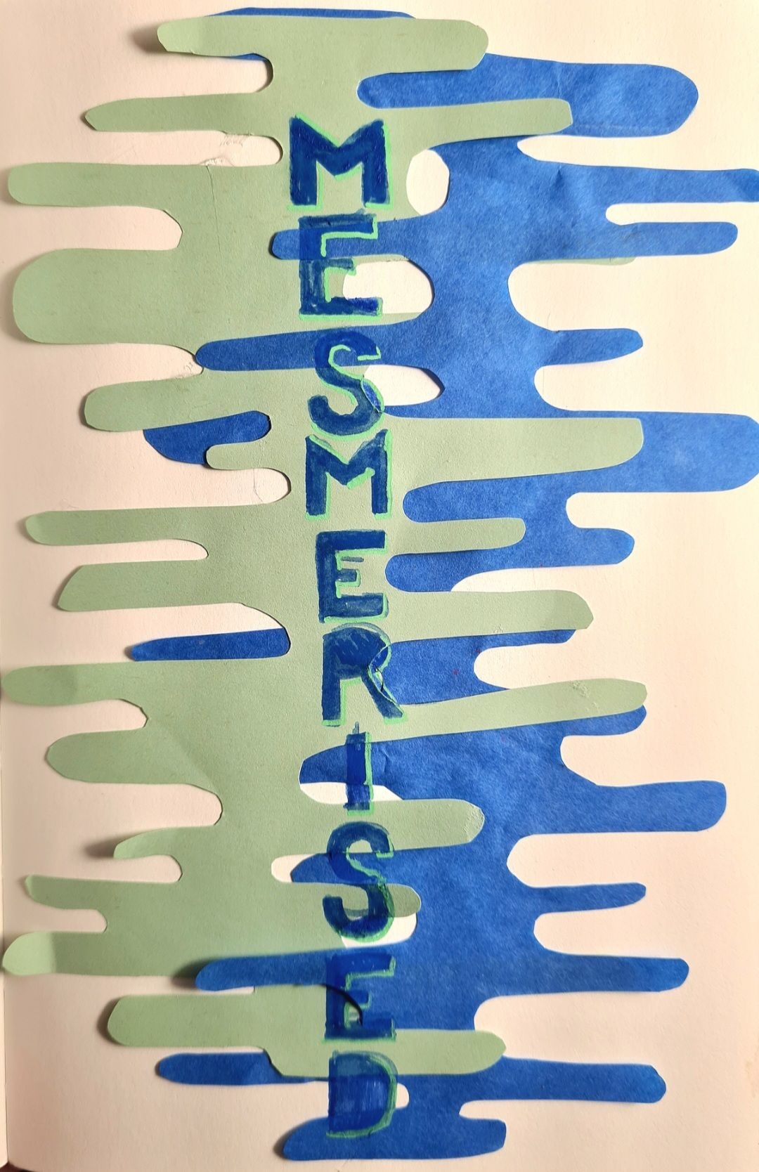 Hand cut green and blue wiggly shaped overlaid with the word 'mesmerised'