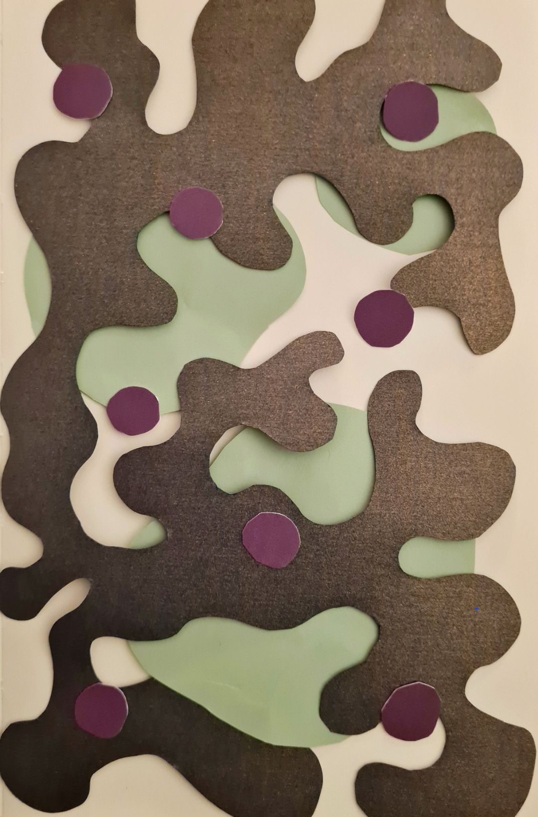 Deep purple wiggly shape layered over green circles with smaller purple circles on top