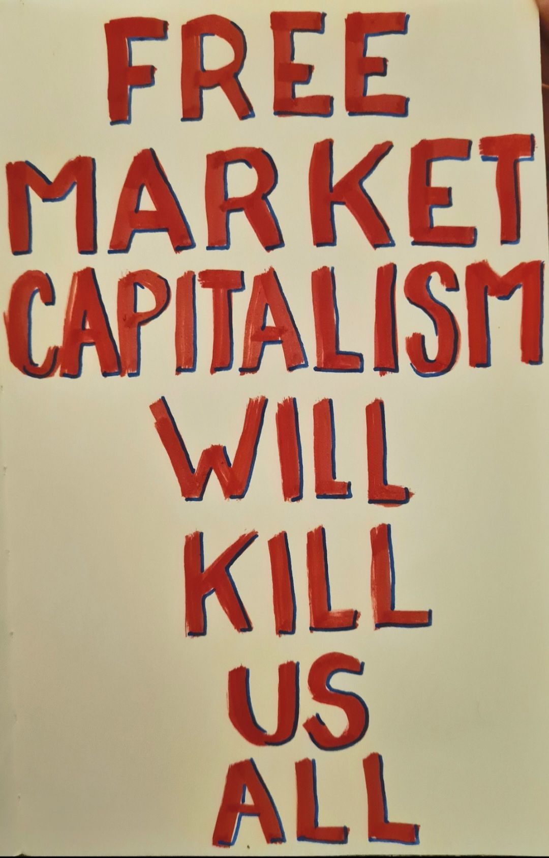 The words 'free market capitalism will kill us all' hand written in thick red lettering, outlined with blue