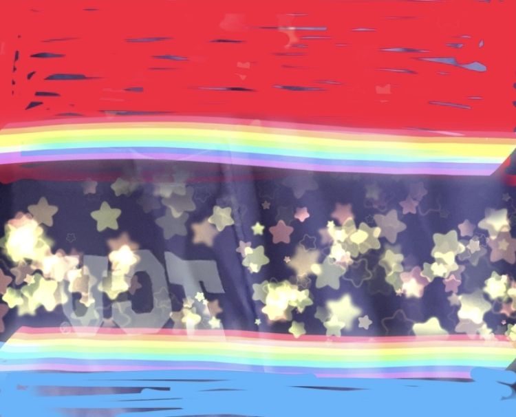 A purple background with red at the top, blue at the bottom, and rainbows in between with gold stsrs on purple in the middle