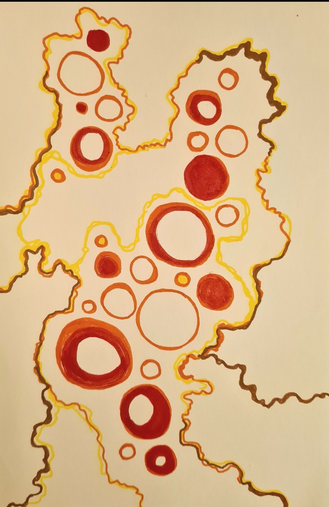 Orange and red circles surrounded by yellow and brown wiggly lines