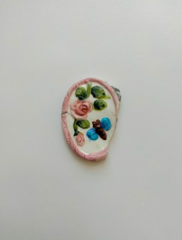 Small piece of found fragment of pottery, possibly a plant pot.