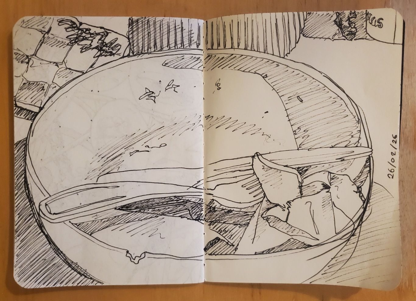 Pen fine liner sketch of an empty bowl with a knife and fork
