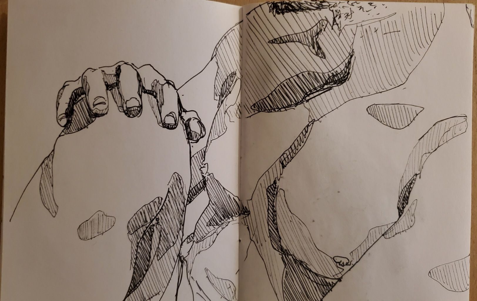 Pen fine liner sketch of a men's torso with his hand resting on his knee