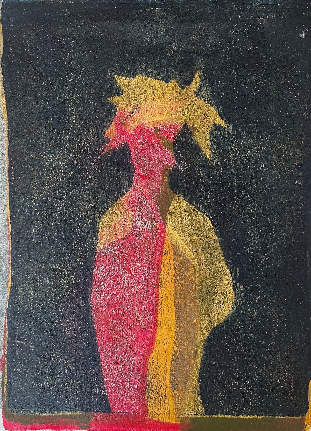 stylised red yellow and black figure with strange head gear.