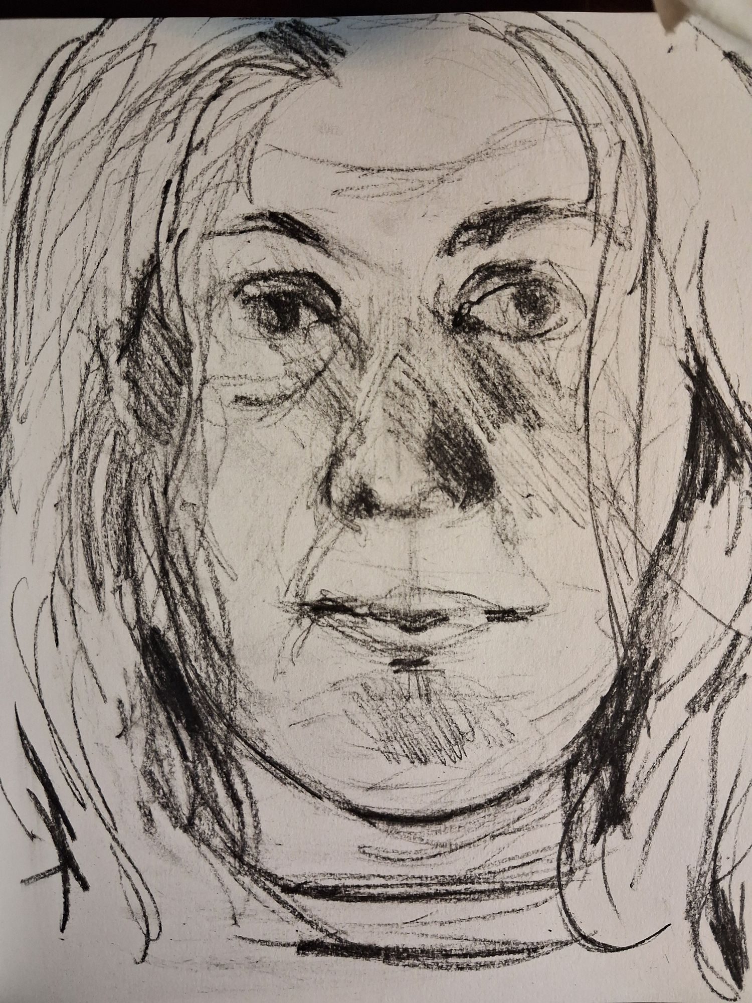black chalk on white paper self portrait
